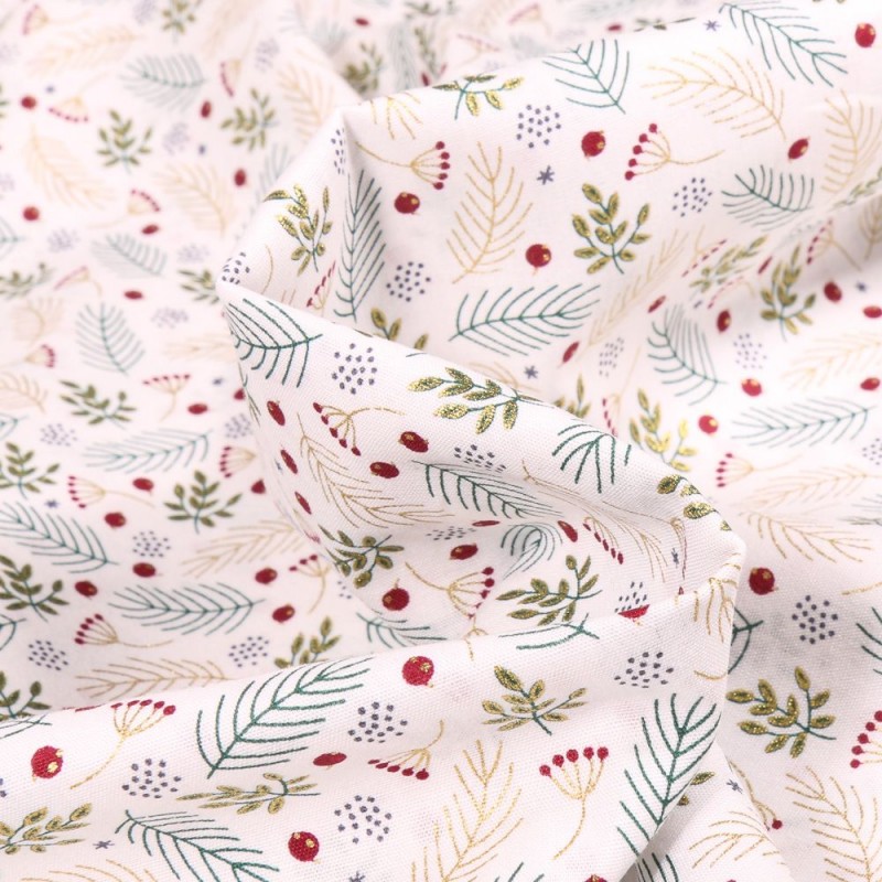 Tissu Coton Feuilles dorées de Noël sur fond Blanc - Par 10 cm